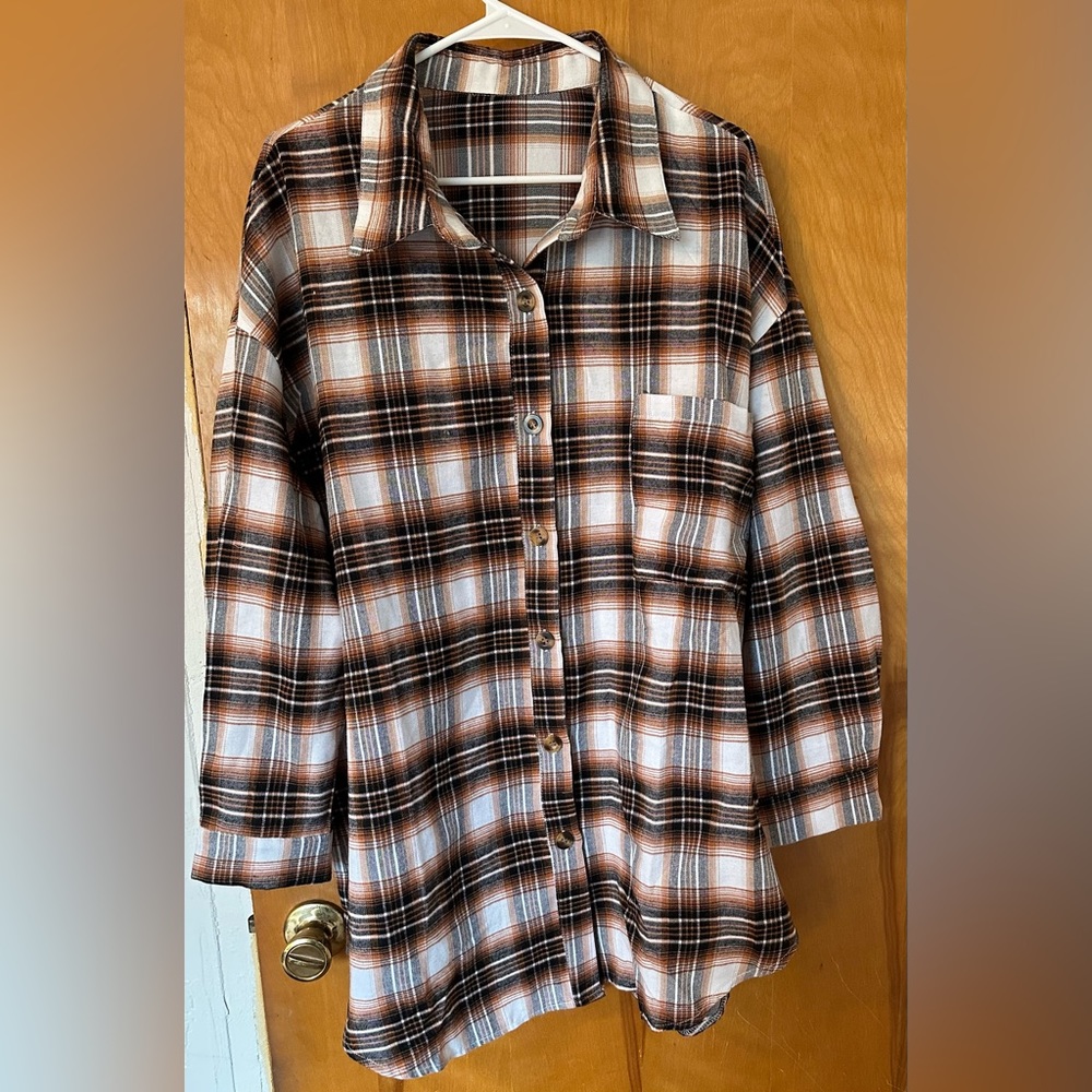 Brand NEW Rust Brown Oversized Flannel button down. Perfect for fall. Never worn
